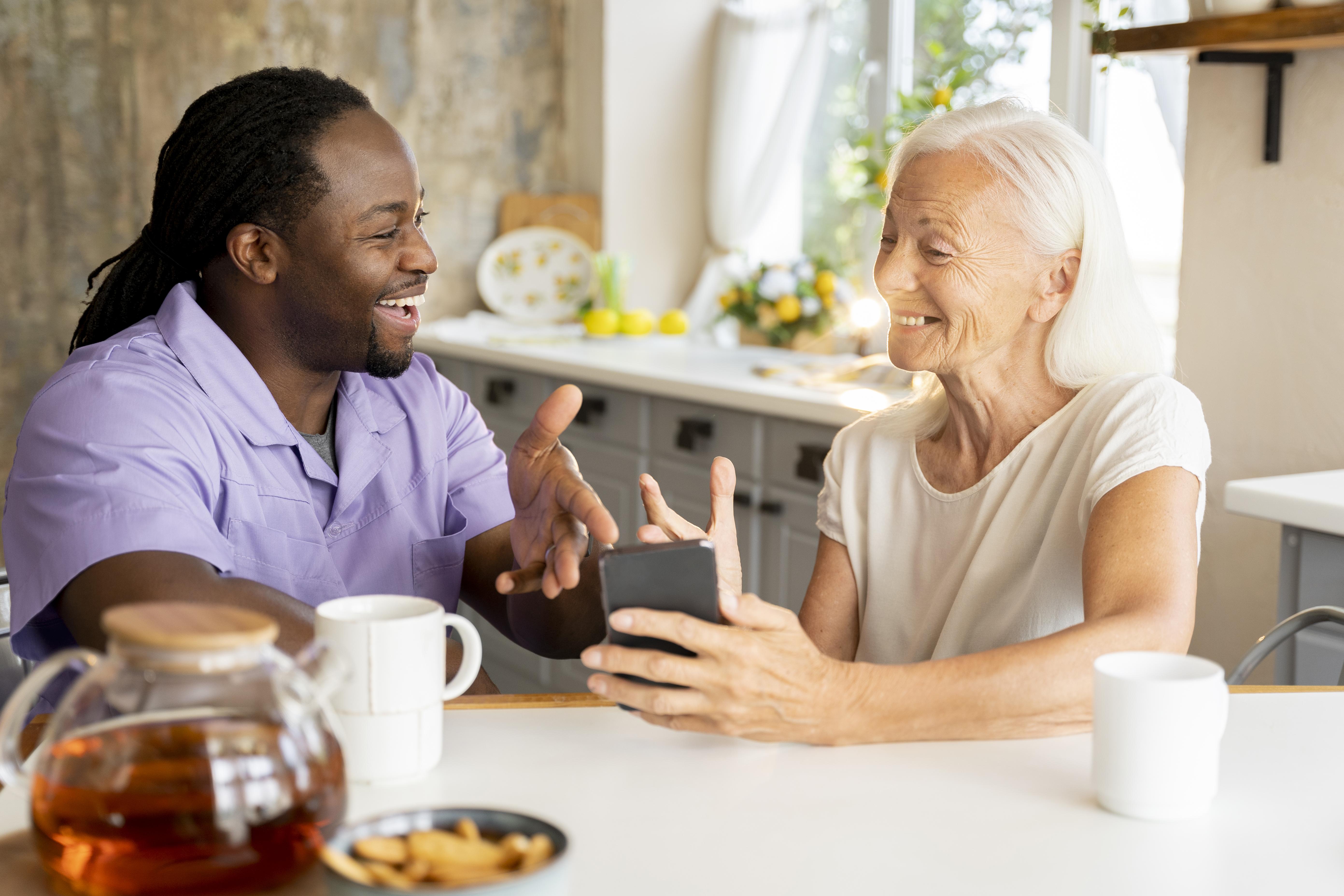 Caregiver and client sharing a warm moment at home
